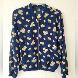 Blue bomber jacket with white daisies